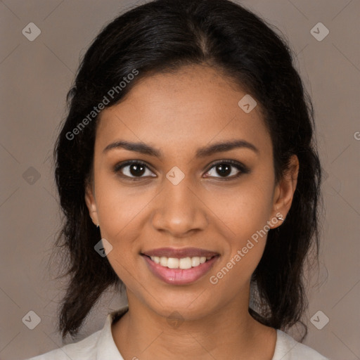 Joyful black young-adult female with medium  brown hair and brown eyes