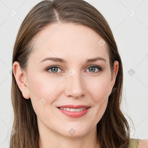 Joyful white young-adult female with long  brown hair and blue eyes