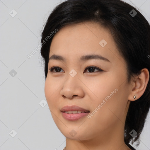 Joyful asian young-adult female with long  brown hair and brown eyes