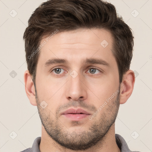 Neutral white young-adult male with short  brown hair and brown eyes