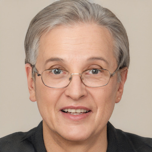 Joyful white middle-aged female with short  brown hair and grey eyes