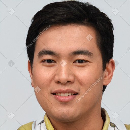 Joyful asian young-adult male with short  brown hair and brown eyes