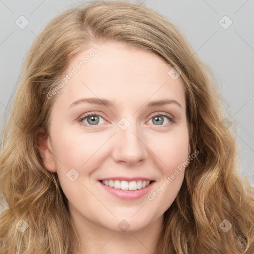 Joyful white young-adult female with long  brown hair and blue eyes