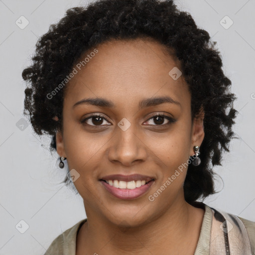 Joyful black young-adult female with long  black hair and brown eyes