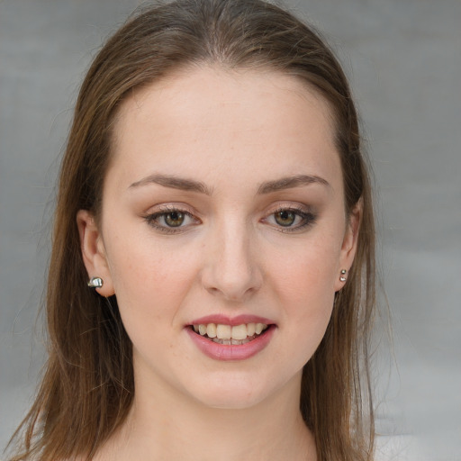 Joyful white young-adult female with long  brown hair and grey eyes