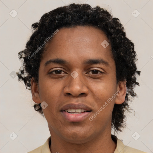 Joyful black young-adult male with short  brown hair and brown eyes