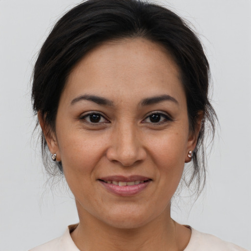 Joyful asian adult female with medium  brown hair and brown eyes
