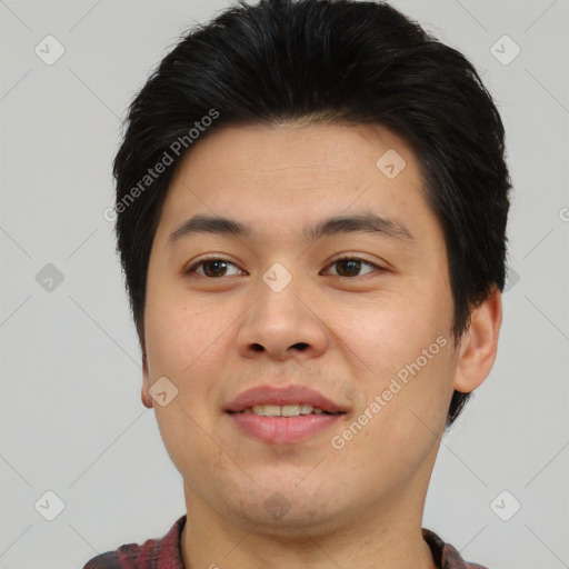 Joyful asian young-adult male with short  brown hair and brown eyes