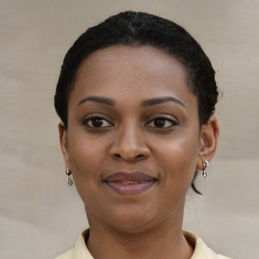 Joyful latino young-adult female with short  black hair and brown eyes