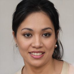 Joyful white young-adult female with medium  brown hair and brown eyes