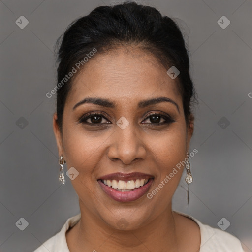 Joyful latino young-adult female with short  brown hair and brown eyes