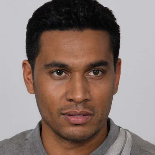 Neutral black young-adult male with short  black hair and brown eyes