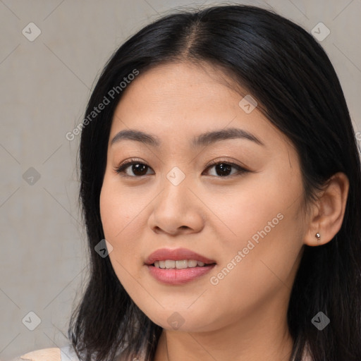 Joyful asian young-adult female with long  black hair and brown eyes