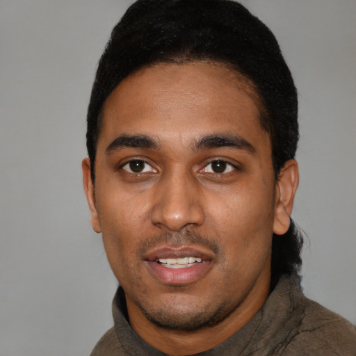 Neutral black young-adult male with short  black hair and brown eyes