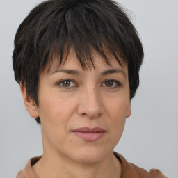 Joyful white adult female with short  brown hair and brown eyes