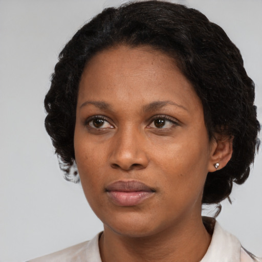 Neutral black adult female with medium  black hair and brown eyes
