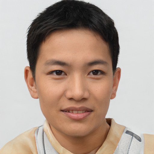 Joyful asian young-adult male with short  black hair and brown eyes