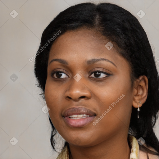 Joyful black young-adult female with long  black hair and brown eyes