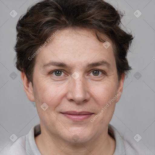 Joyful white adult female with short  brown hair and brown eyes