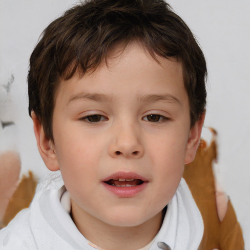 Joyful white child male with short  brown hair and brown eyes