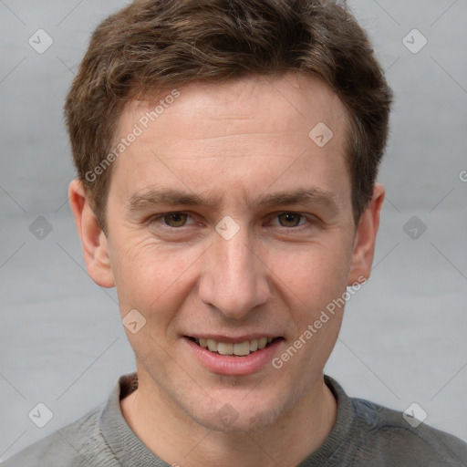 Joyful white adult male with short  brown hair and grey eyes