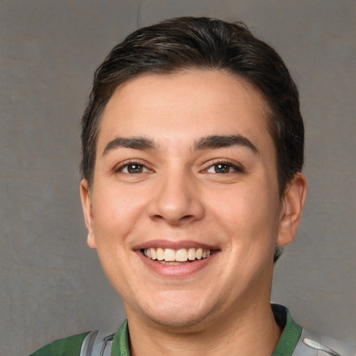 Joyful white young-adult male with short  brown hair and brown eyes