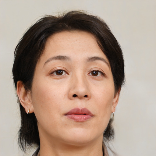 Neutral white adult female with medium  brown hair and brown eyes