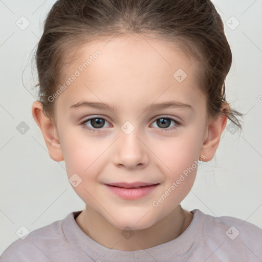 Joyful white child female with short  brown hair and brown eyes