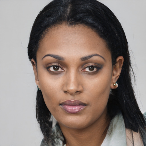 Neutral black young-adult female with medium  black hair and brown eyes
