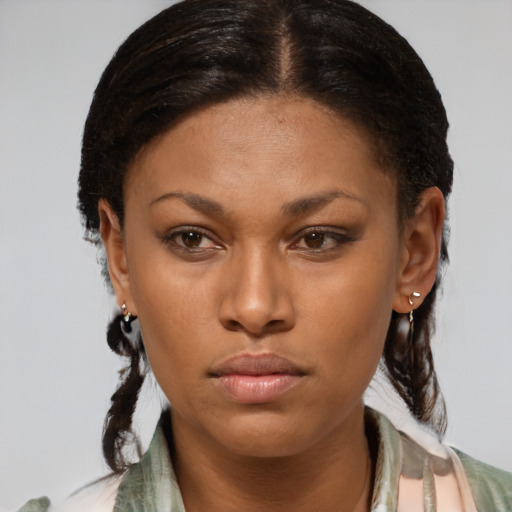 Neutral black young-adult female with medium  brown hair and brown eyes