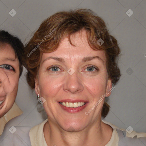 Joyful white adult female with medium  brown hair and blue eyes