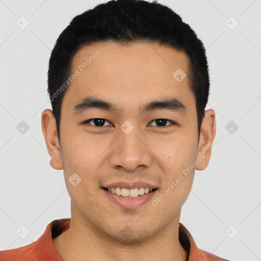 Joyful latino young-adult male with short  brown hair and brown eyes