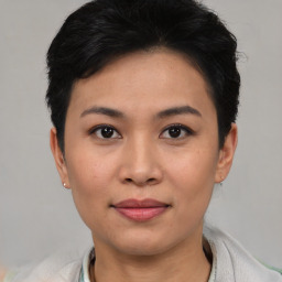 Joyful asian young-adult female with short  black hair and brown eyes