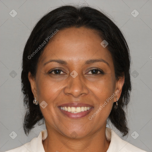 Joyful black adult female with medium  brown hair and brown eyes