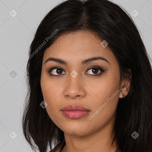 Joyful latino young-adult female with long  brown hair and brown eyes