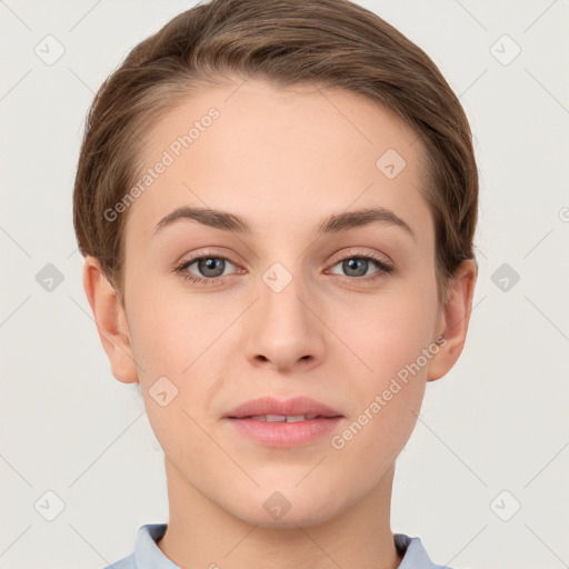 Joyful white young-adult female with short  brown hair and grey eyes