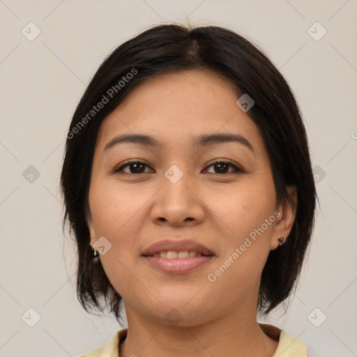 Joyful latino young-adult female with medium  brown hair and brown eyes