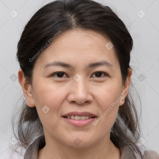 Joyful white adult female with medium  brown hair and brown eyes