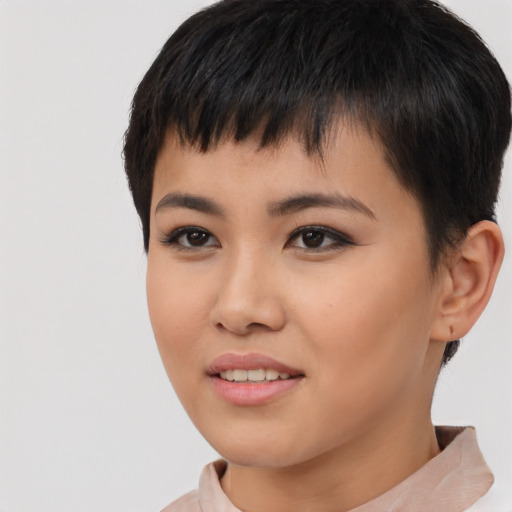 Joyful asian young-adult female with short  black hair and brown eyes