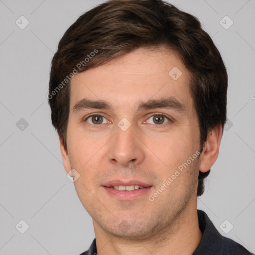 Joyful white young-adult male with short  brown hair and brown eyes