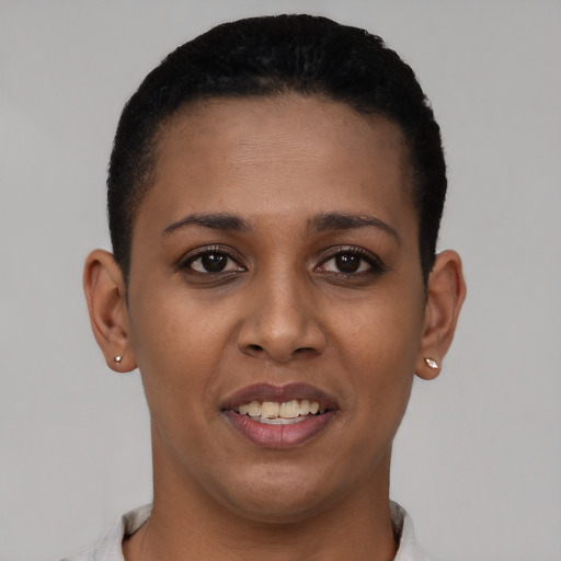 Joyful latino young-adult female with short  brown hair and brown eyes