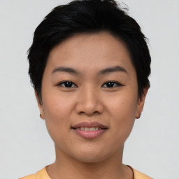 Joyful asian young-adult female with short  black hair and brown eyes