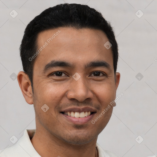 Joyful asian young-adult male with short  black hair and brown eyes