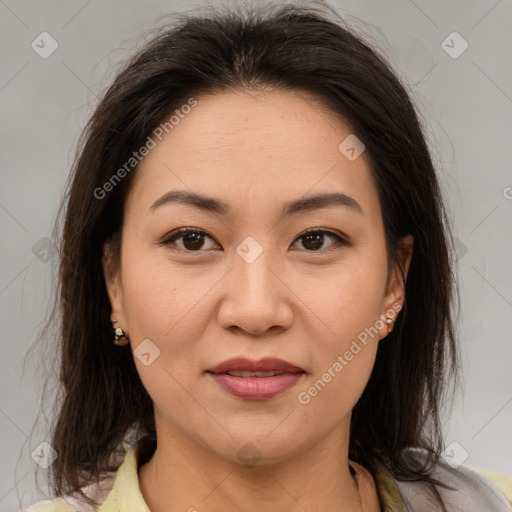 Joyful latino young-adult female with medium  brown hair and brown eyes