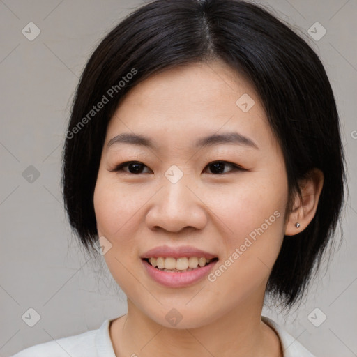 Joyful asian young-adult female with medium  black hair and brown eyes