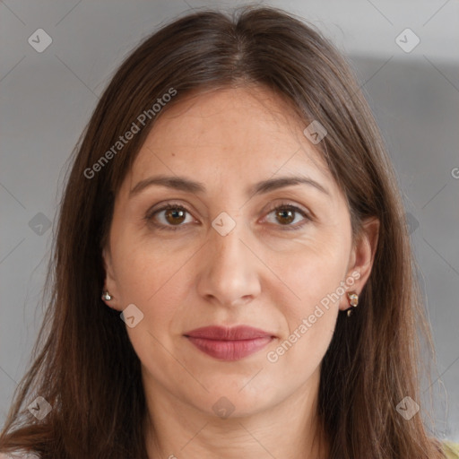 Joyful white adult female with long  brown hair and brown eyes