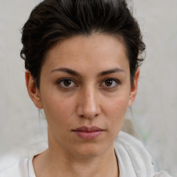 Neutral white young-adult female with short  brown hair and brown eyes