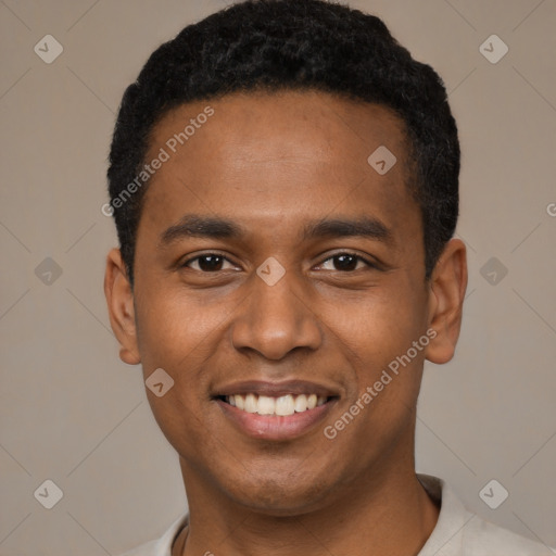 Joyful black young-adult male with short  black hair and brown eyes