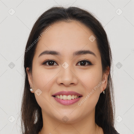 Joyful latino young-adult female with long  brown hair and brown eyes