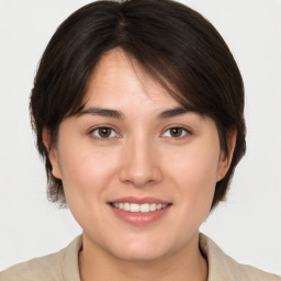 Joyful white young-adult female with medium  brown hair and brown eyes